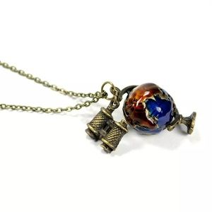 Bronze globe with binoculars necklace
